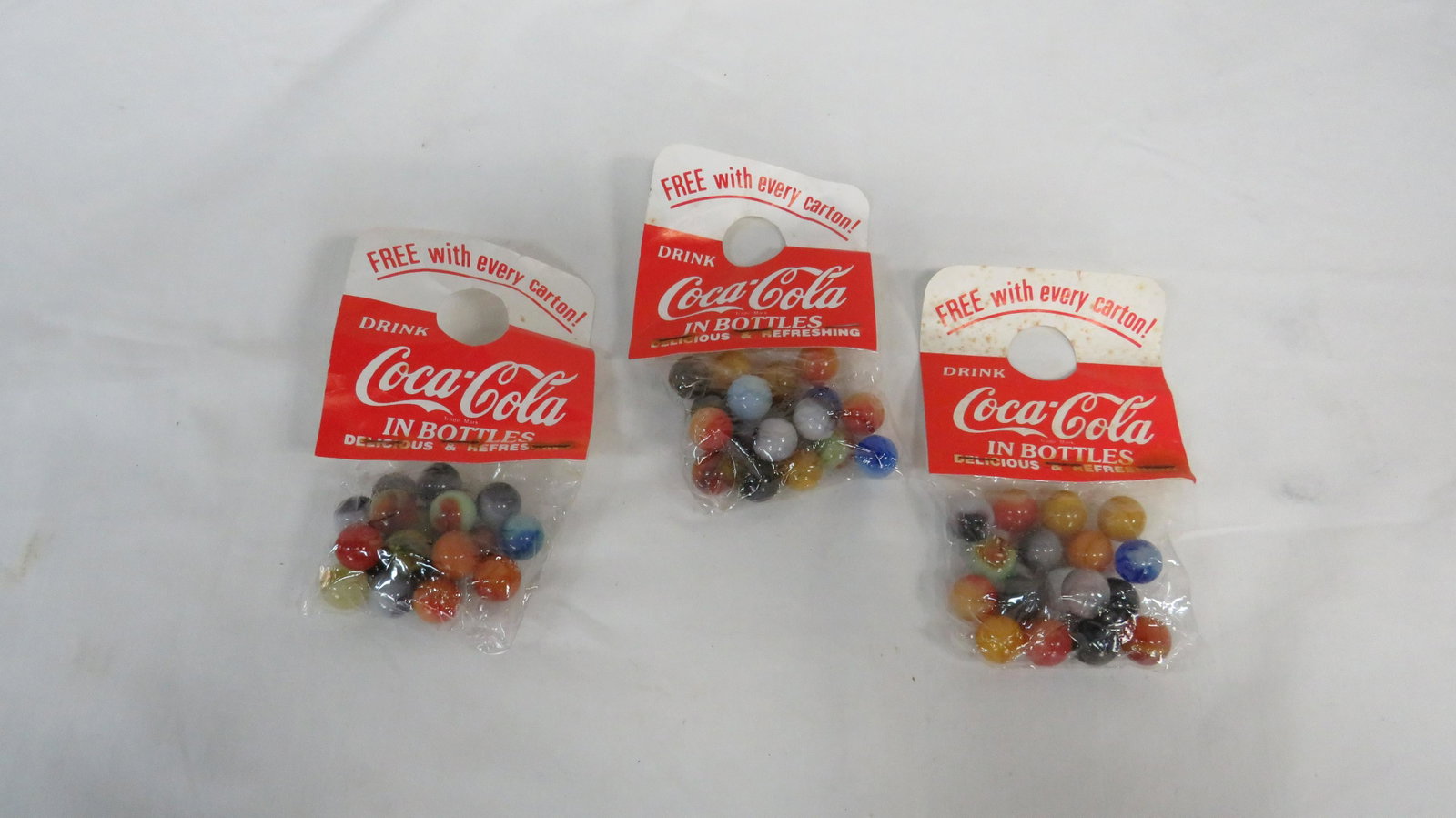 3 Vintage1960s Bags Coca Cola Promo Marbles: 3 Vintage1960s Bags Coca Cola Promo Marbles unopened in good condition.