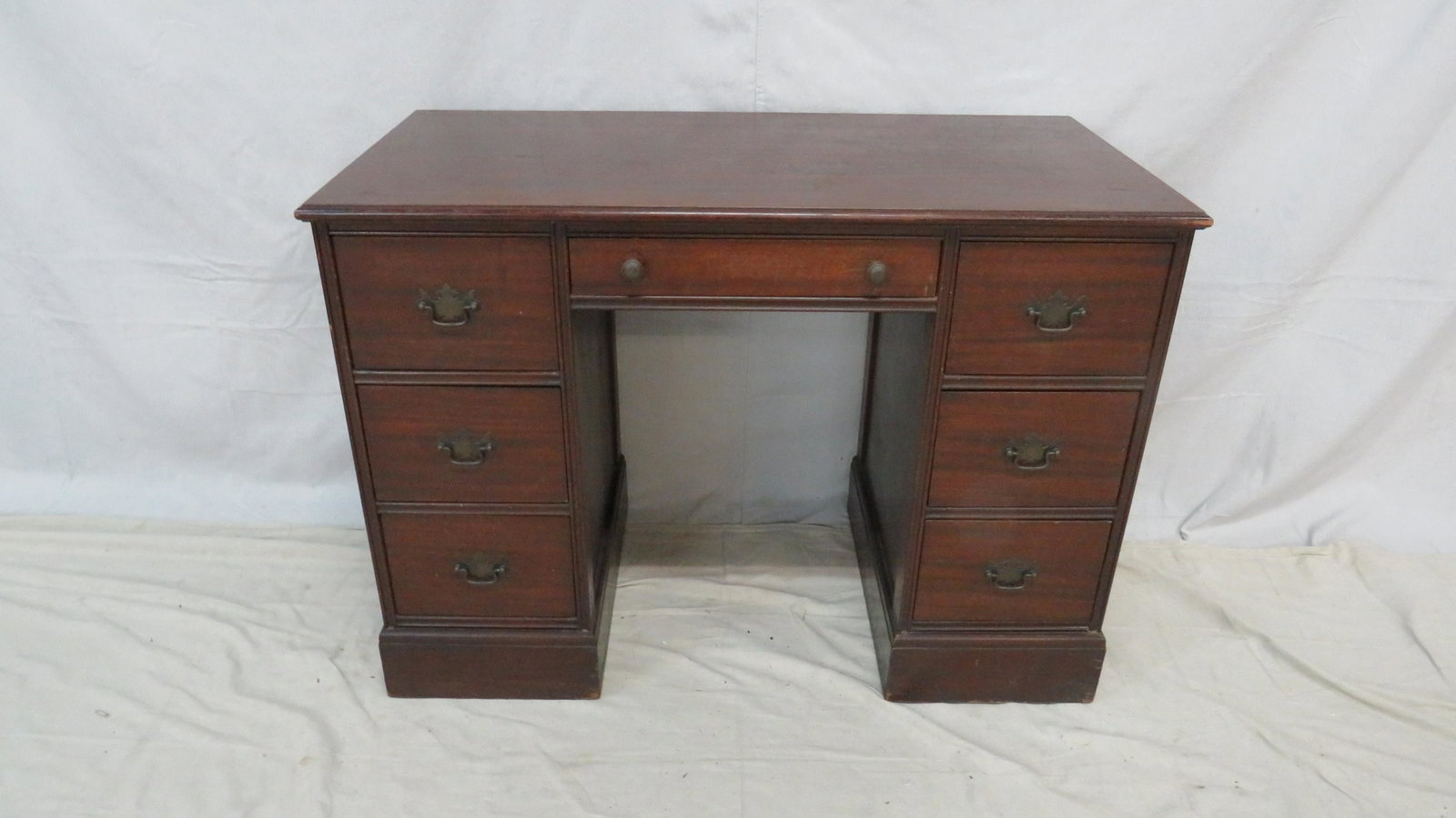 Mahogany Kneehole Desk: Mahogany Kneehole Desk in good condition, Dovetailed Drawers with Brass Hardware, John Wanamaker Furniture, 30''H x 42.5''W x 21.5''D