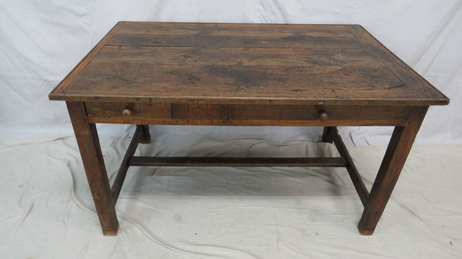 French Antique Farm Table: French Antique Farm Table in good condition, Late 1700's-Early 1800's, Pegged Construction with Mortis and Tendon Stretcher Base, Two Dovetailed Drawers, Hand Chamfered, Wooden Pulls, 29.5''H x 52''W
