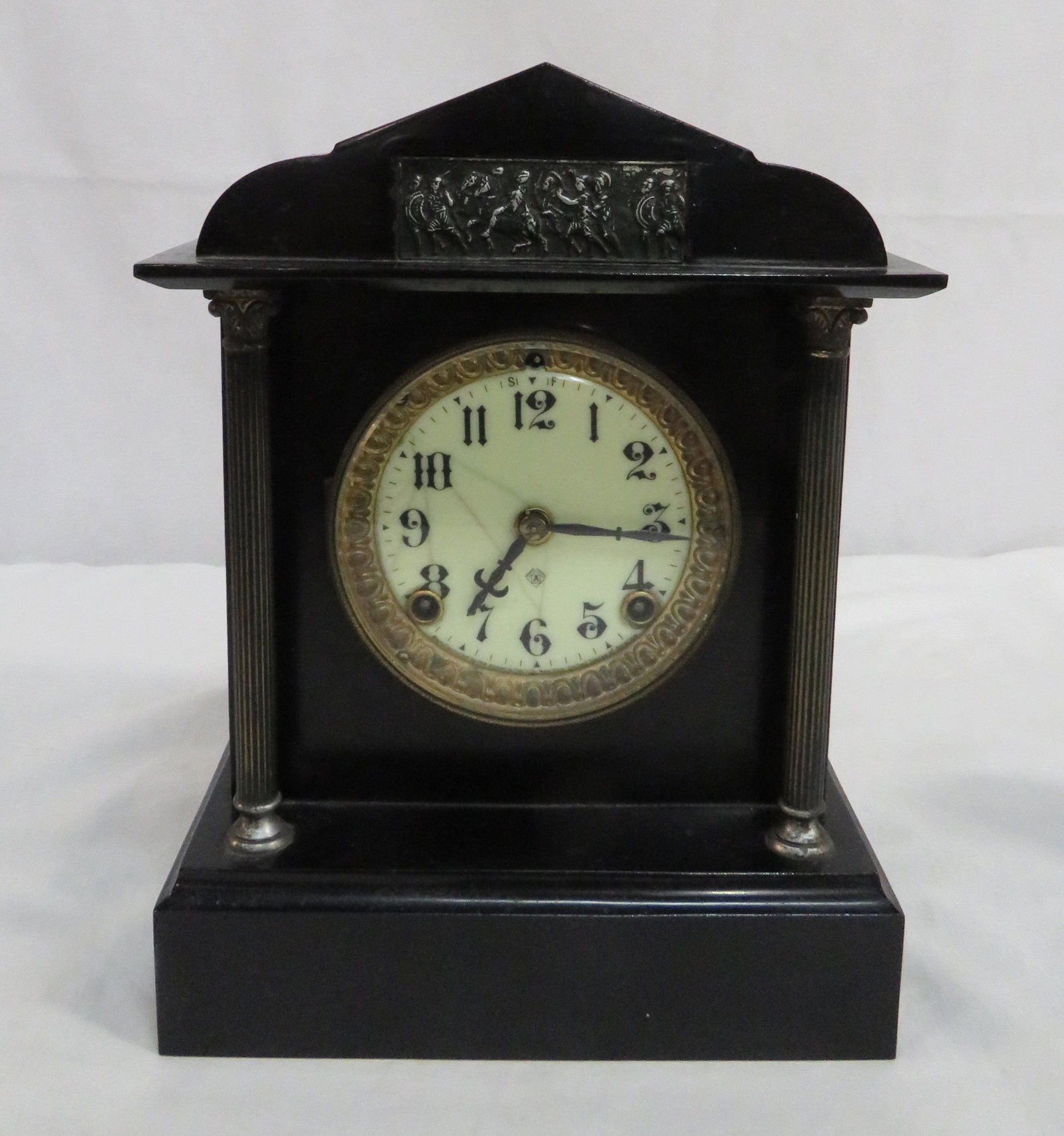 19th Century Ansonia Neoclassical Mantel Clock: 19th Century Ansonia Neoclassical Mantel Clock in good condition with some lines in the porcelain face. Strikes on the hour and half hour. Running when cataloged. sold with no warranties or guarantees