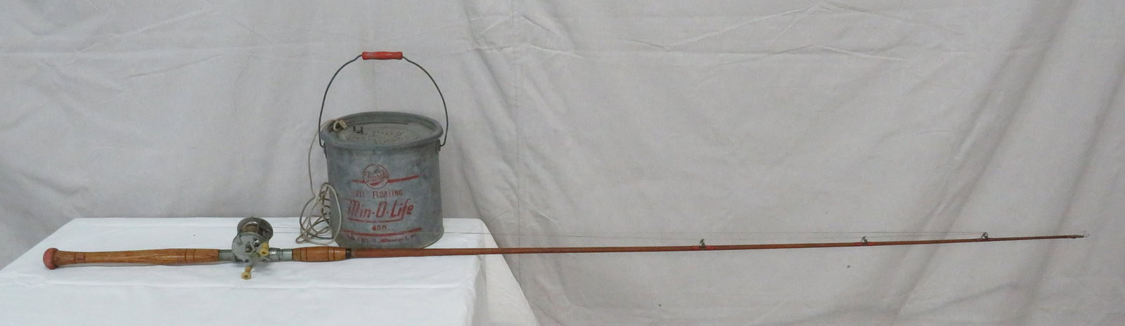 Vintage Minnow Bucket with Rod & Reel: Vintage Minnow Bucket with Rod & Reel in good condition. Galvanized Frabills Full Floating Bucket. All wood rodwith #915 Southbend reel. Good condition with age appropriate wear. Bucket 9"H Rod 85"L