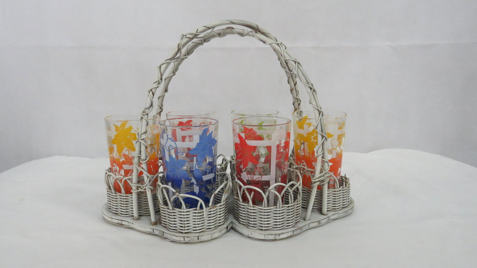 Vintage Set 6 Swanky Swigs Glasses in Holder: Vintage Set 6 Swanky Swigs Glasses in Holder in good condition with some wear to wicker holder. Glasses 4.5"H50