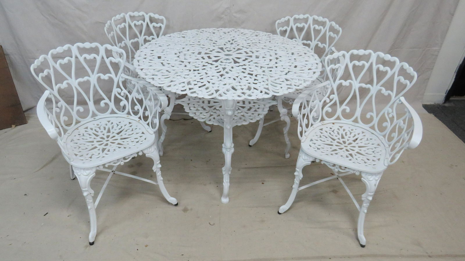 Cast Aluminum Outdoor Table and Four Chairs: Cast Aluminum Outdoor Table and Four Chairs in good condition, All Arm Chairs,