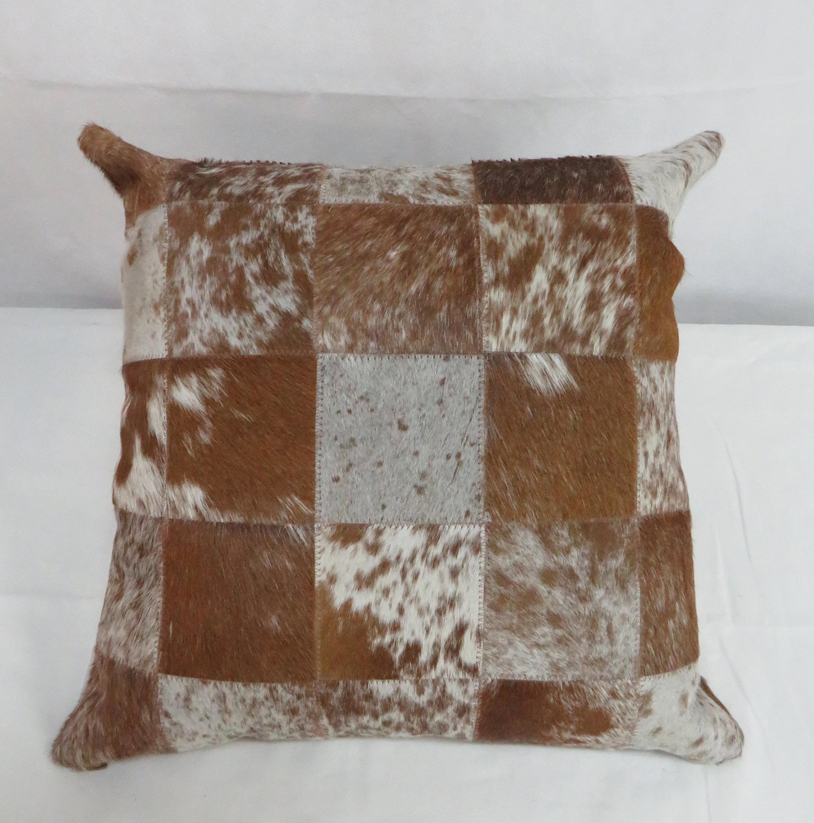 Brown, White, & Gray Cow Hide Pillow: Brown, White, & Gray Cow Hide Pillow in good condition. 18" x 18'