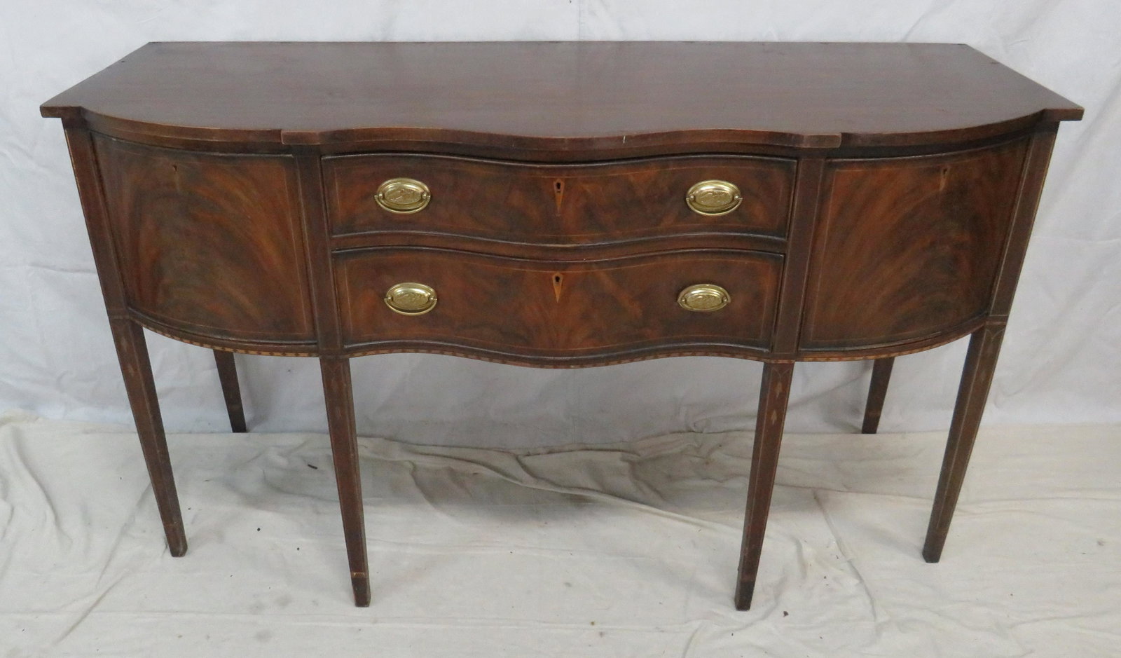 Henkel Harris Flame Mahogany Sideboard: Henkel Harris Flame Mahogany Sideboard in good condition, Inlays, Dovetailed Drawers, Serpentine Front, Brass Hardware, missing gallery across top, 38.5"H x 66"W x 24"D