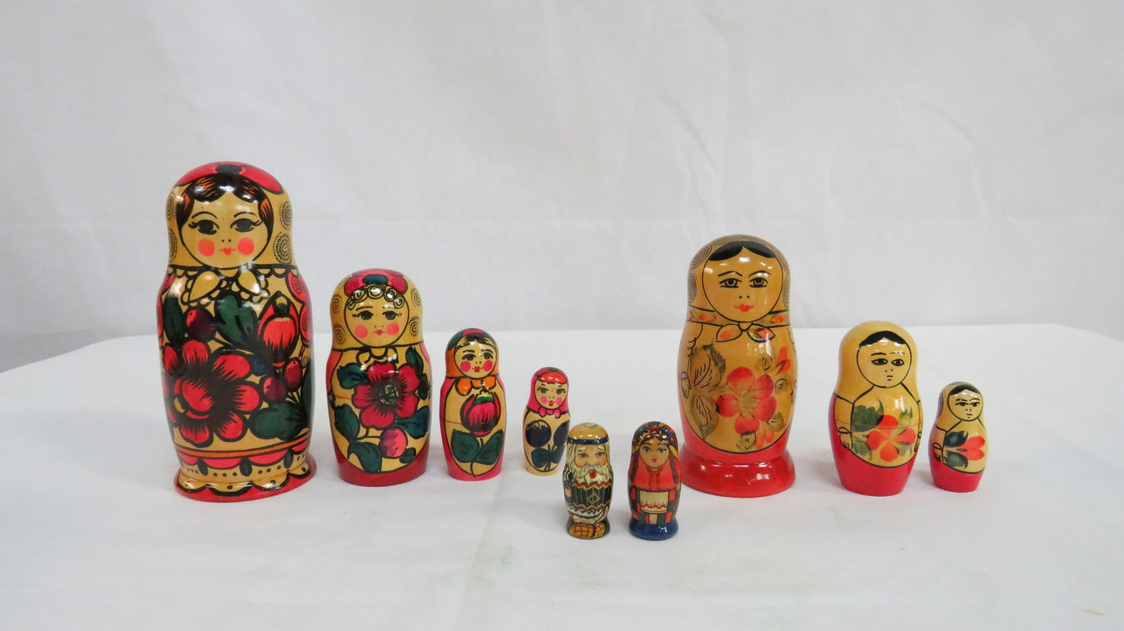 Grouping of Russian Nesting Dolls: Grouping of Russian Nesting Dolls in good condition. Paper labels on the bottom. 6"H and 4.5"H
