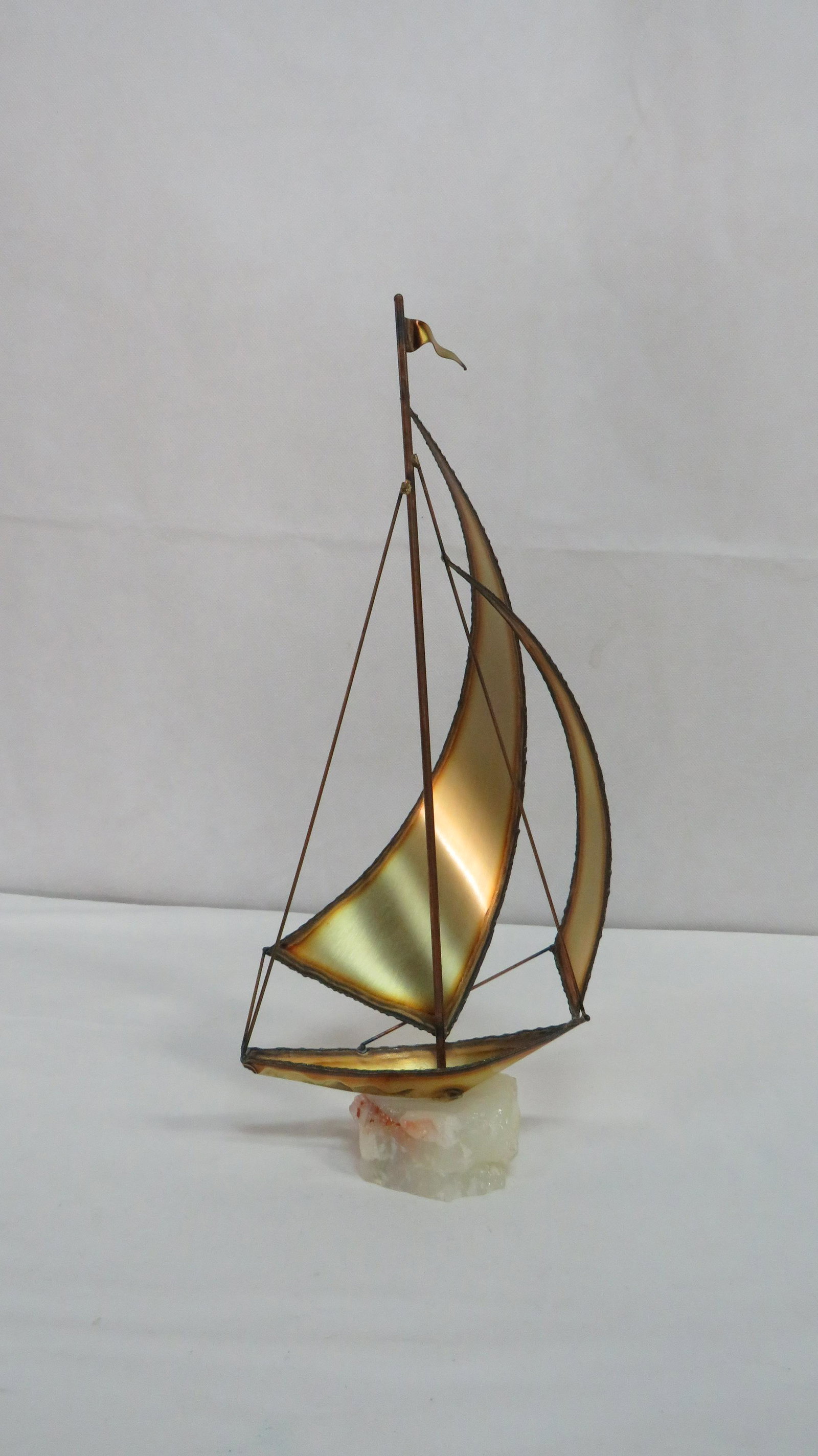 Mid Century Modern Jere Sailboat Sculpture: Mid Century Modern Jere Sailboat Sculpture in good condition. Metal sculpture on onxy base. Signed by the artist. 15"H