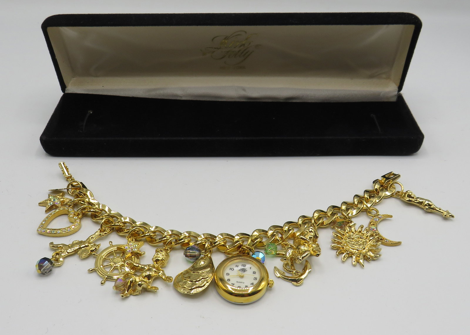 Kirks Folly Charm Bracelet: Kirks Folly Charm Bracelet costume jewelry in original box.