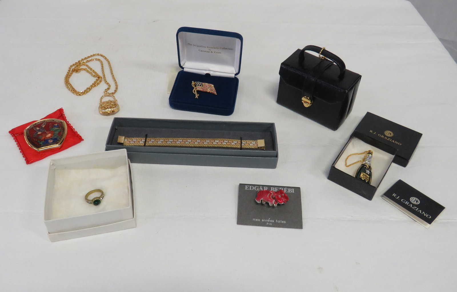 Group Designer Costume Jewelry 925 Bracelet: Group Designer Costume Jewelry 925 Bracelet. Group includes Multi-toned bracelet marked Italy 925, R J Graziano animated popping cork champaigne bottle, Camrose & Cross Jackie Kennedy replica flag pin