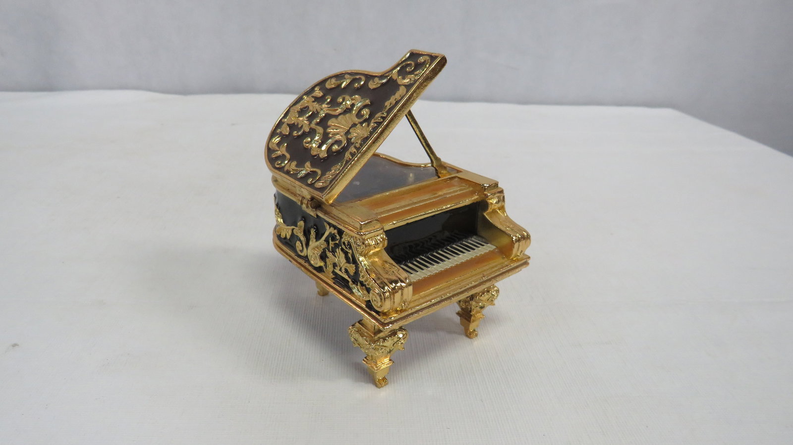 Vintage Enameled Gold Metal Piano Music Box: Vintage Enameled Gold Metal Piano Music Box in good condition. 3.25"H x 3"W x 4"D