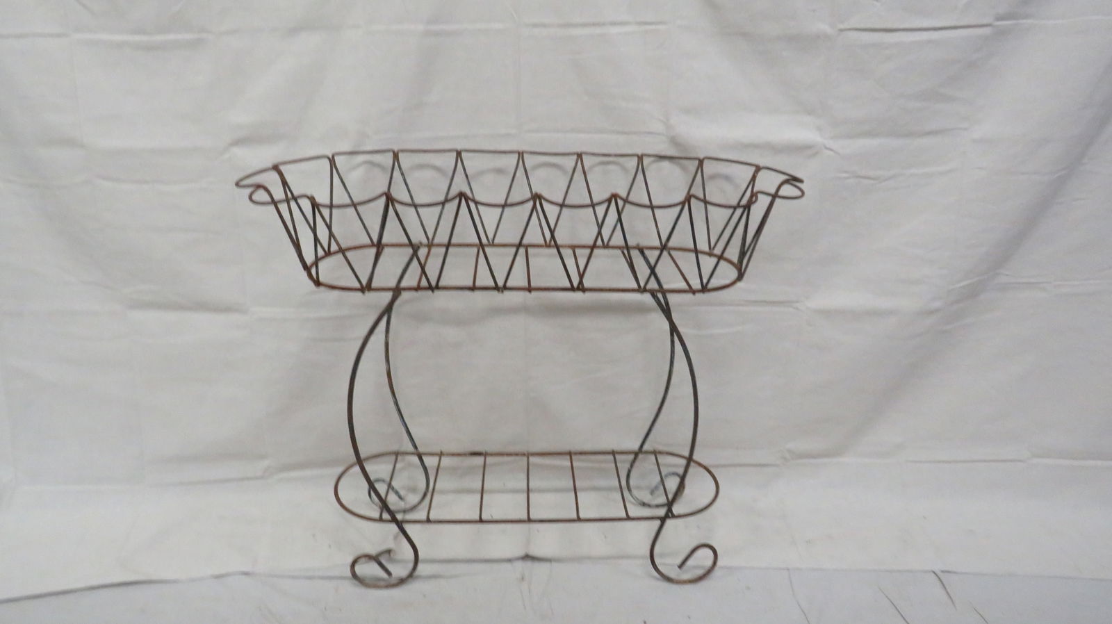 Wrought Iron Oval Planter: Wrought Iron Oval Planter in good condition, 32''H x 40.5''W x 17.5''D
