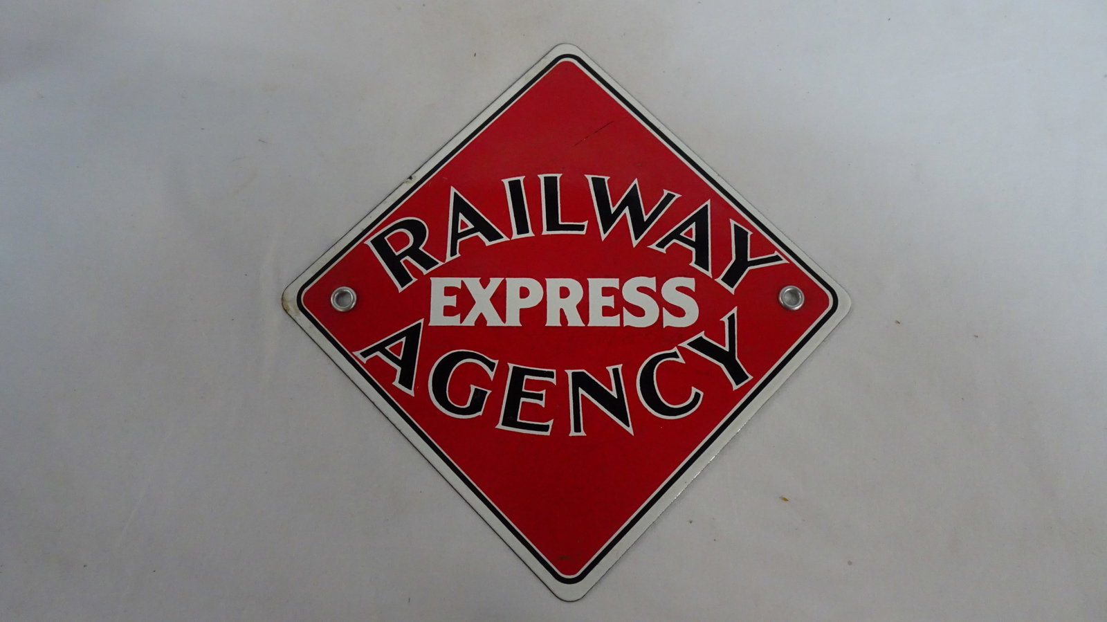 Railway Express Agency Porcelain Sign: Railway Express Agency Porcelain Sign in good condition. 11" x 11"