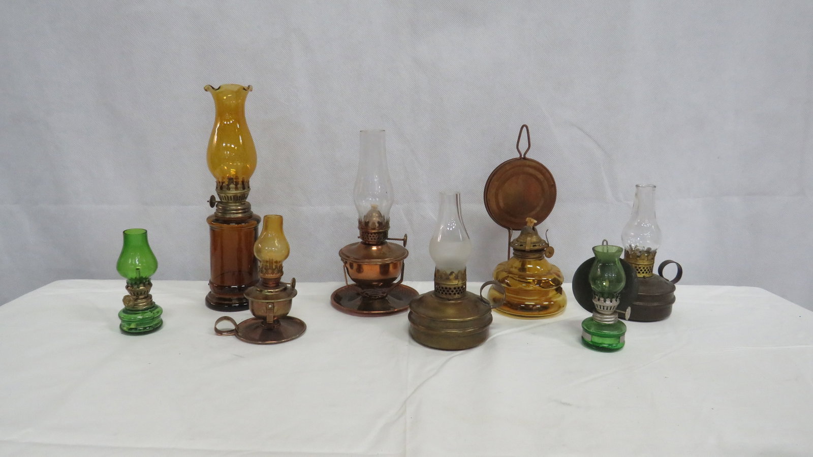 Vintage Collection 8 Miniature Oil Lamps: Vintage Collection 8 Miniature Oil Lamps in good condition. 8 lamps 7 chimneys. 3.75" H to 9.5"H