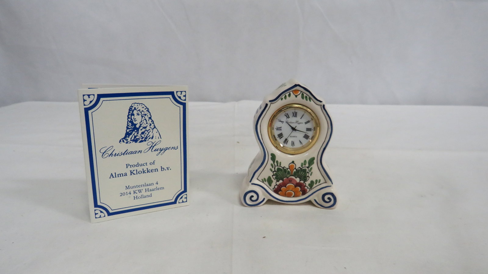 Christiaan Huygens Delft Miniature Clock: Christiaan Huygens Delft Miniature Clock in good condition with original certificate and box. Handpainted, signed, and numbered. 3.5"H