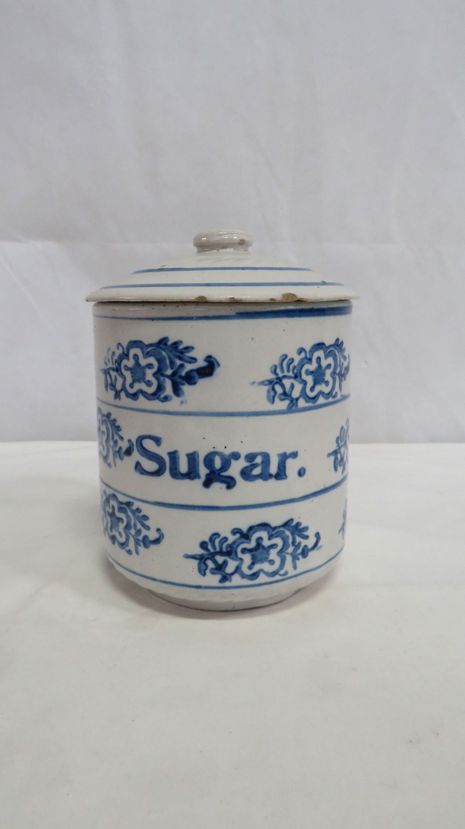 Primitive Blue & White Stoneware Sugar Crock: Primitive Blue & White Stoneware Sugar Crock in good condition with some rim chips on the lid. 6.5"H