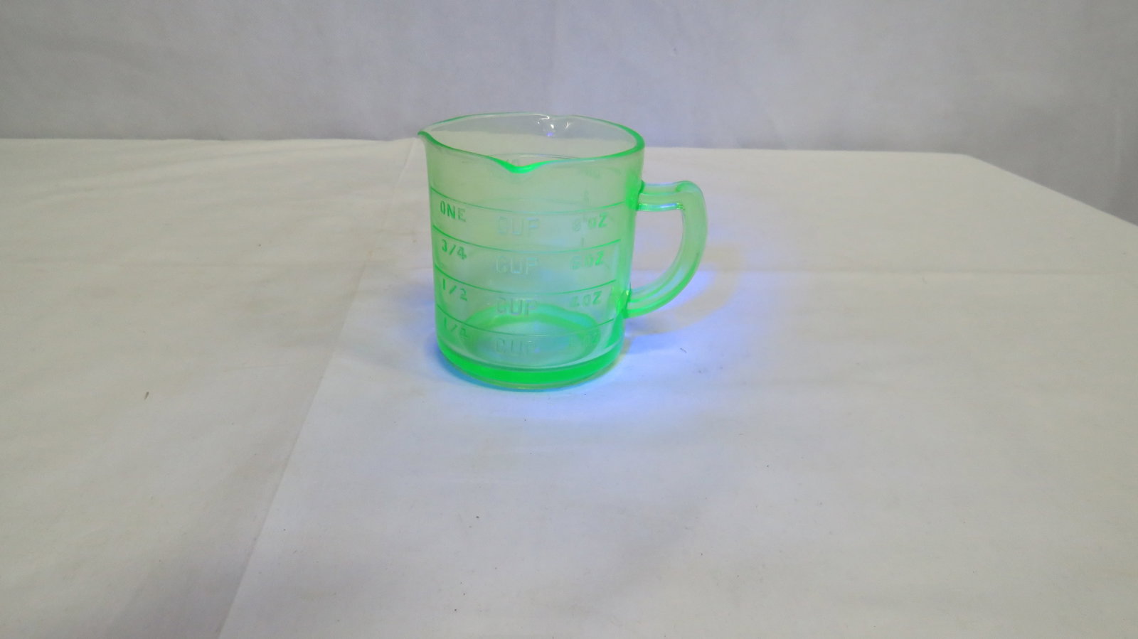 1930's Uranium Glass Kelloggs Measuring Cup: 1930's Uranium Glass 3 Spout Kelloggs Measuring Cup. Between 1930 and 1937 these green cups were a premium in Kelloggs free gift collection. the only other color offered was pink. Measuring one cup wi