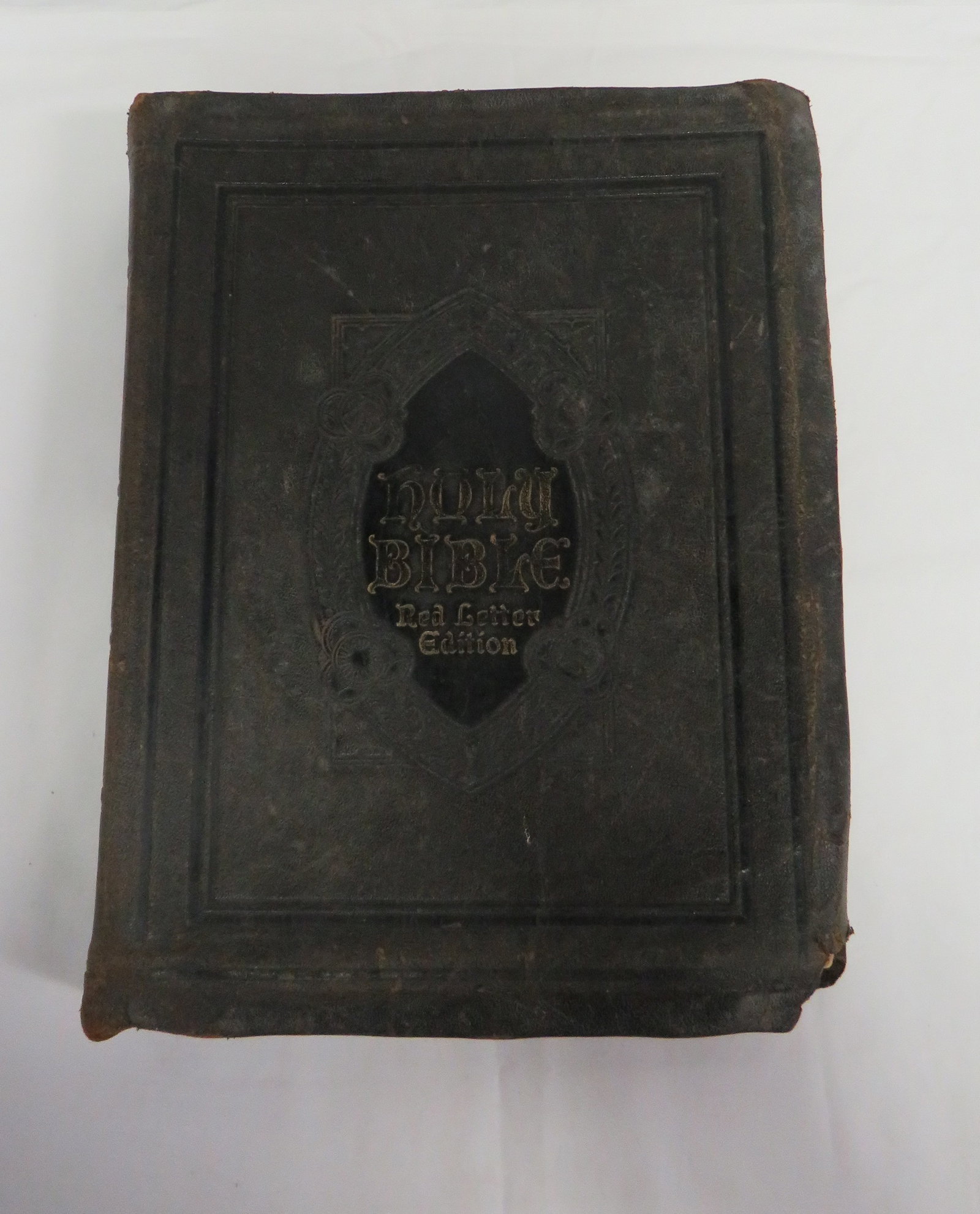 1925 Leather Bound Oversize Bible Red Letter: 1925 Leather Bound Oversize Bible Red Letter with age appropriate wear. Binding is loose but pages are intact. 13" x 10"