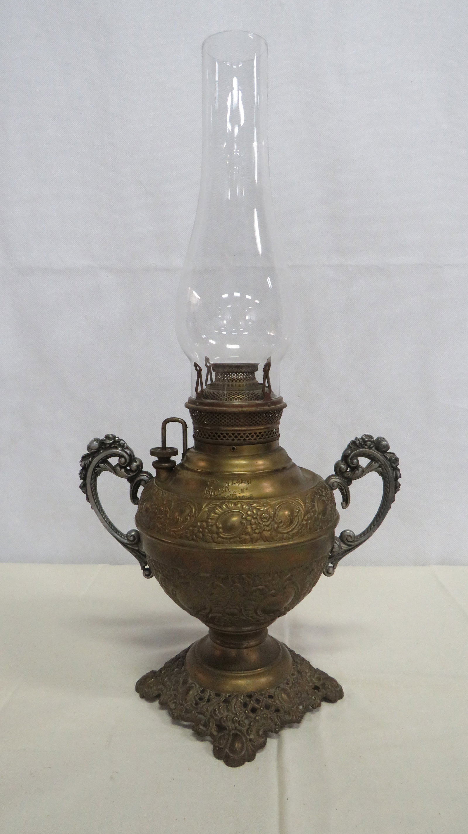 Antique Miller Ornate Brass & Nickel Oil Lamp: Antique Miller Ornate Brass & Nickel Oil Lamp in good condition. Patent dates 1893 on burner and wick wheel. Over height 20"