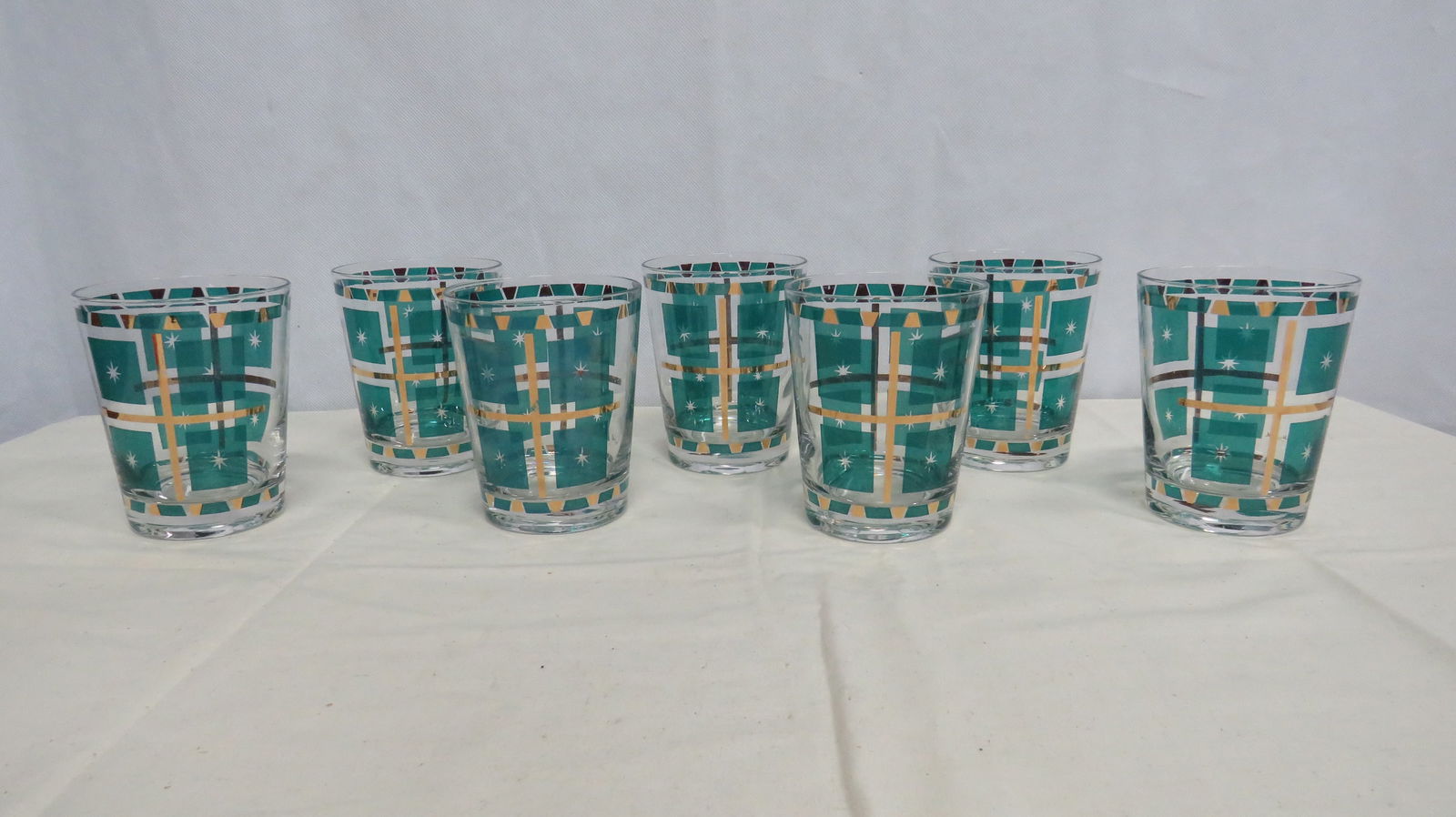 MCM Fran Taylor Gay Fad Atomic Barware Glasses: MCM Fran Taylor Gay Fad Atomic Barware Glasses in good condition. "Gift Wrap" pattern turquoise and 22kt gold with stylized starbursts. Produced c. 1954-1962 as part of the atomic or space-age style.
