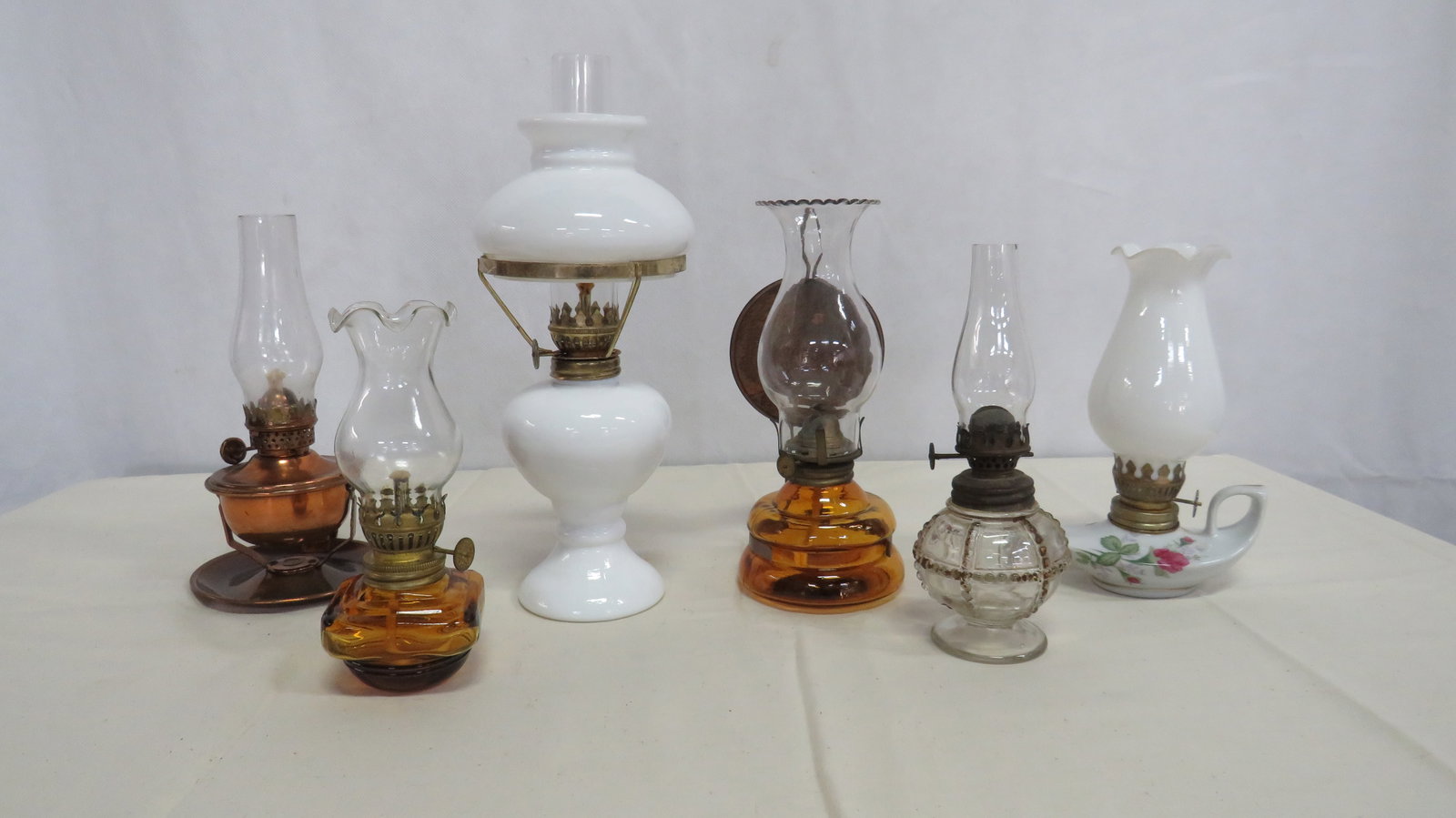 6 Vintage Miniature Oil Lamps: 6 Vintage Miniature Oil Lamps in good condition. 6.75"H - 10.5"H