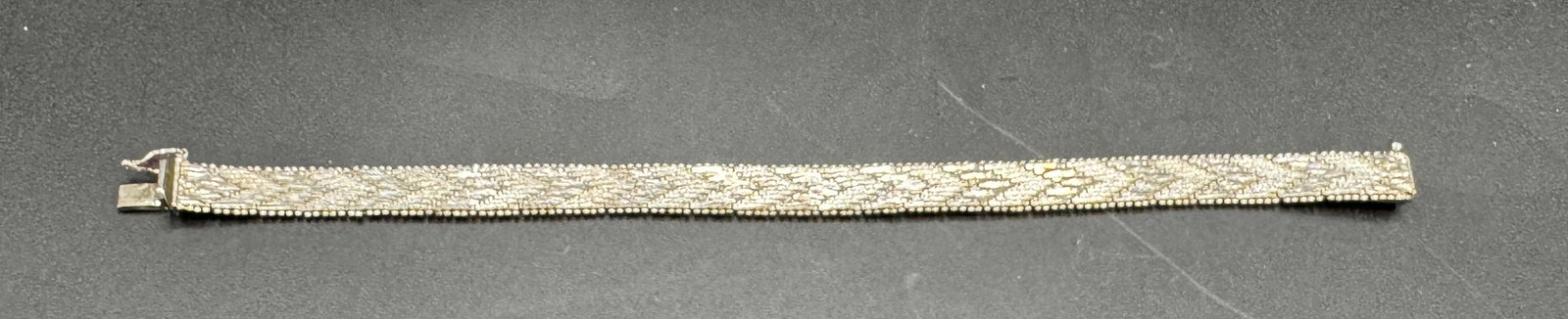Sterling Silver Woven Herringbone Bracelet: Sterling Silver Woven Herringbone Bracelet in good condition, Marked .925 Italy, 7" Long, Safety Clasp, 19g
