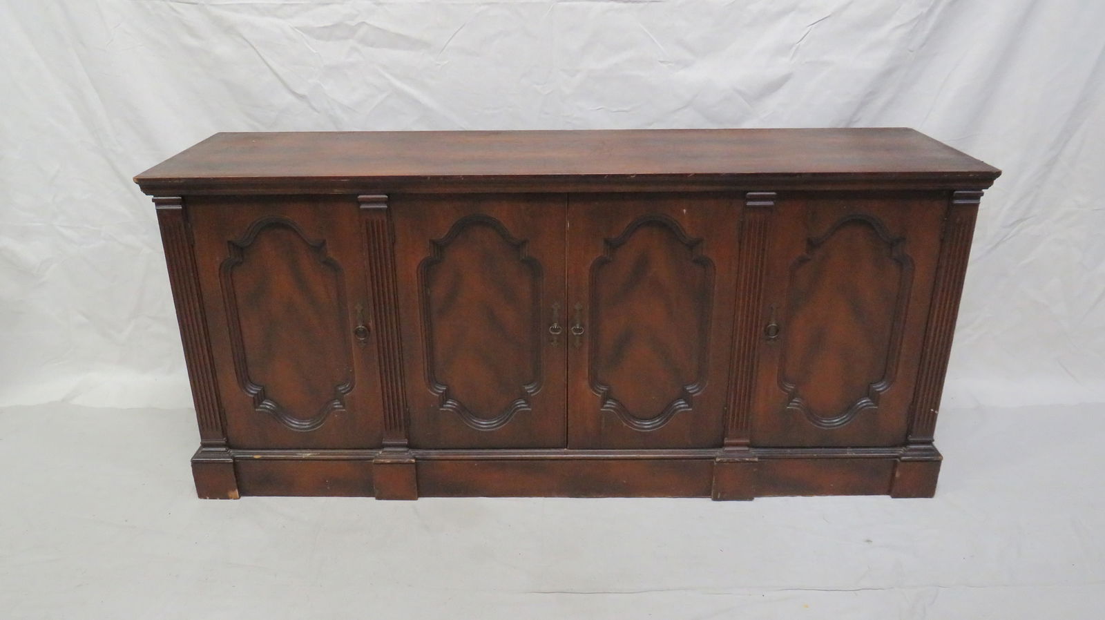 Traditional Regency Sideboard: Traditional Regency Sideboard in good condition, shows some signs of use, some veneer damage to bottom of cabinet on sides, 31''H x 70''W x 19''D