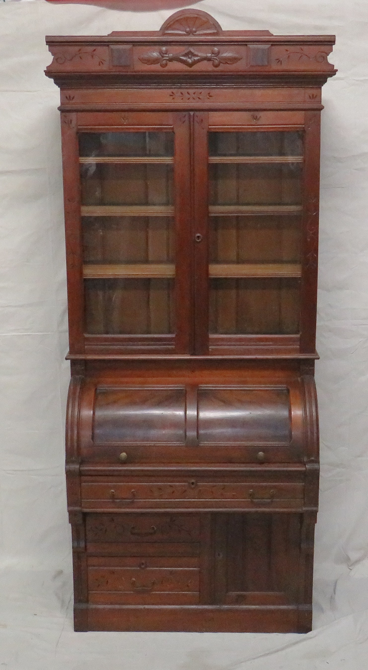 19th C. Eastlake Walnut Barrel Roll Cylinder Desk: 19th C. Eastlake Walnut Barrel Roll Cylinder Desk with Bookcase Top in good condition, Fitted Interior, Leather Pull Out Writing Surface, Dovetailed Drawers, Spoon Carved Case, Breaks Down into Multip