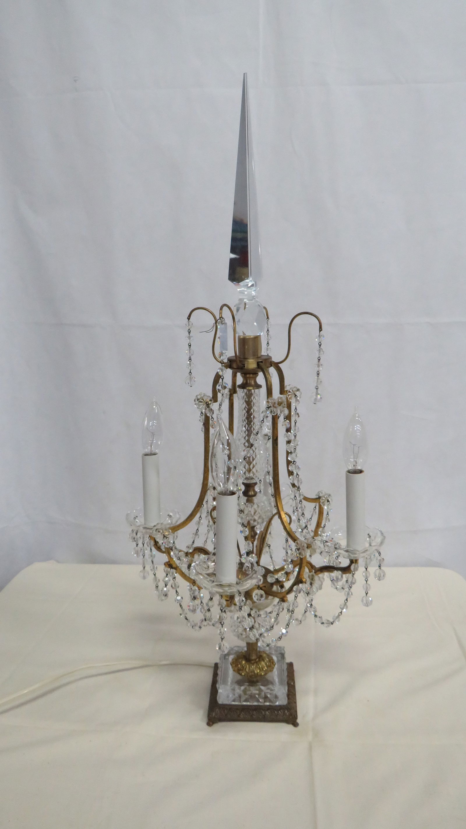 MCM German Crystal Table Chandelier Lamp: MCM German Crystal Table Chandelier Lamp in good condition. German crystal 4-light table chandelier lamp, mid 20th century, with a Made in Germany tag. Featuring a tall crystal obelisk finial, crystal