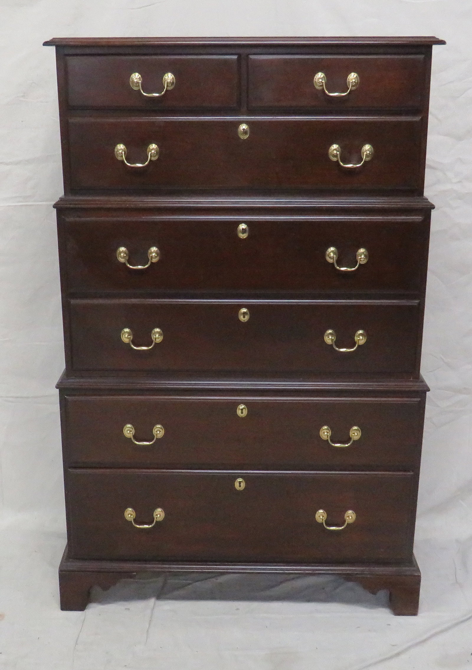 Vintage Harden Georgian Triple Chest on Chest: Vintage Harden Georgian Triple Chest on Chest in good condition, Dovetailed Drawers with Brass Hardware, Burn In Mark on Drawer, Bracket Feet, 59.5''H x 39''W x 18.5''D