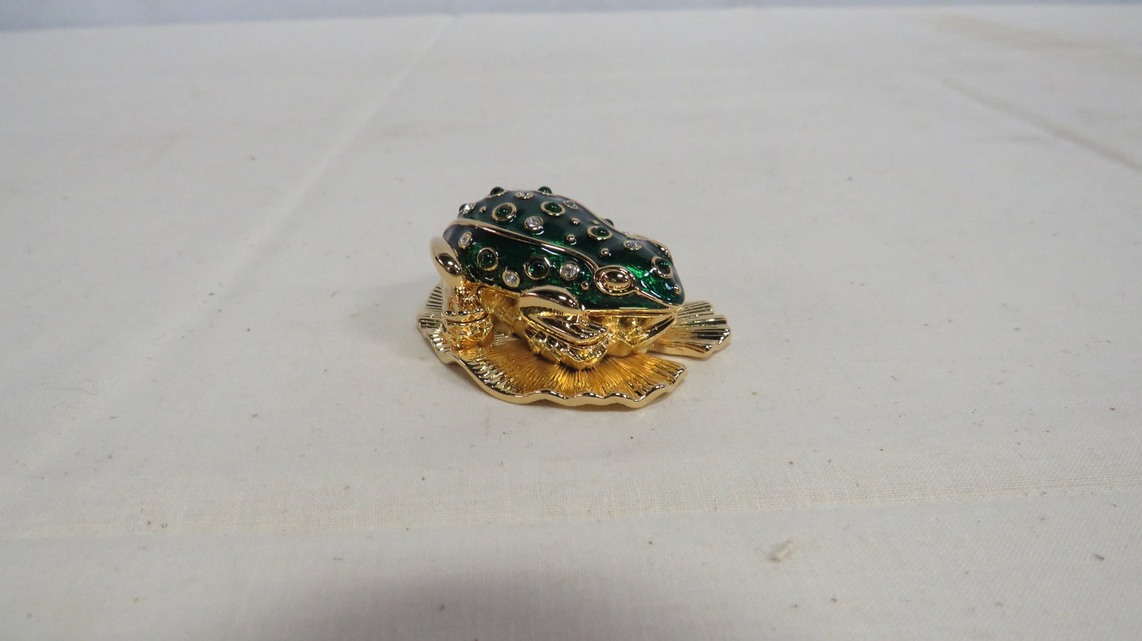 Kenneth J Lane Enamel & Rhinestone Frog Brooch: Kenneth J Lane Enamel & Rhinestone Frog Brooch in good condition. It is part of the "Critter Box" series where the base can also function as a trinket box.1"H x 1.75"L x 2"W