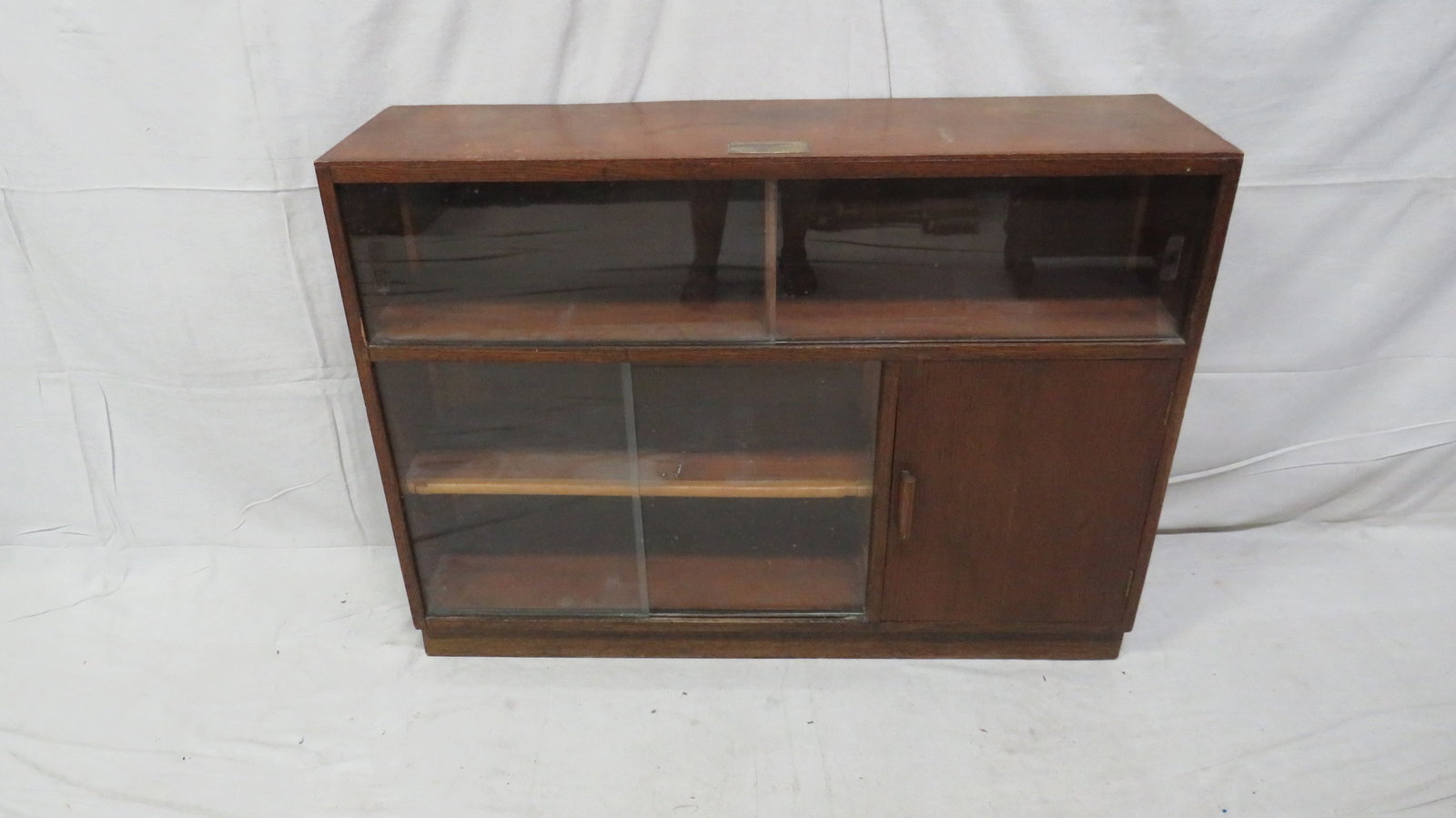 Vintage English Oak Mid Century Bookcase: Vintage English Oak Mid Century Bookcase in good condition, Sliding Glass Doors, 33''H x 45''W x 12''D
