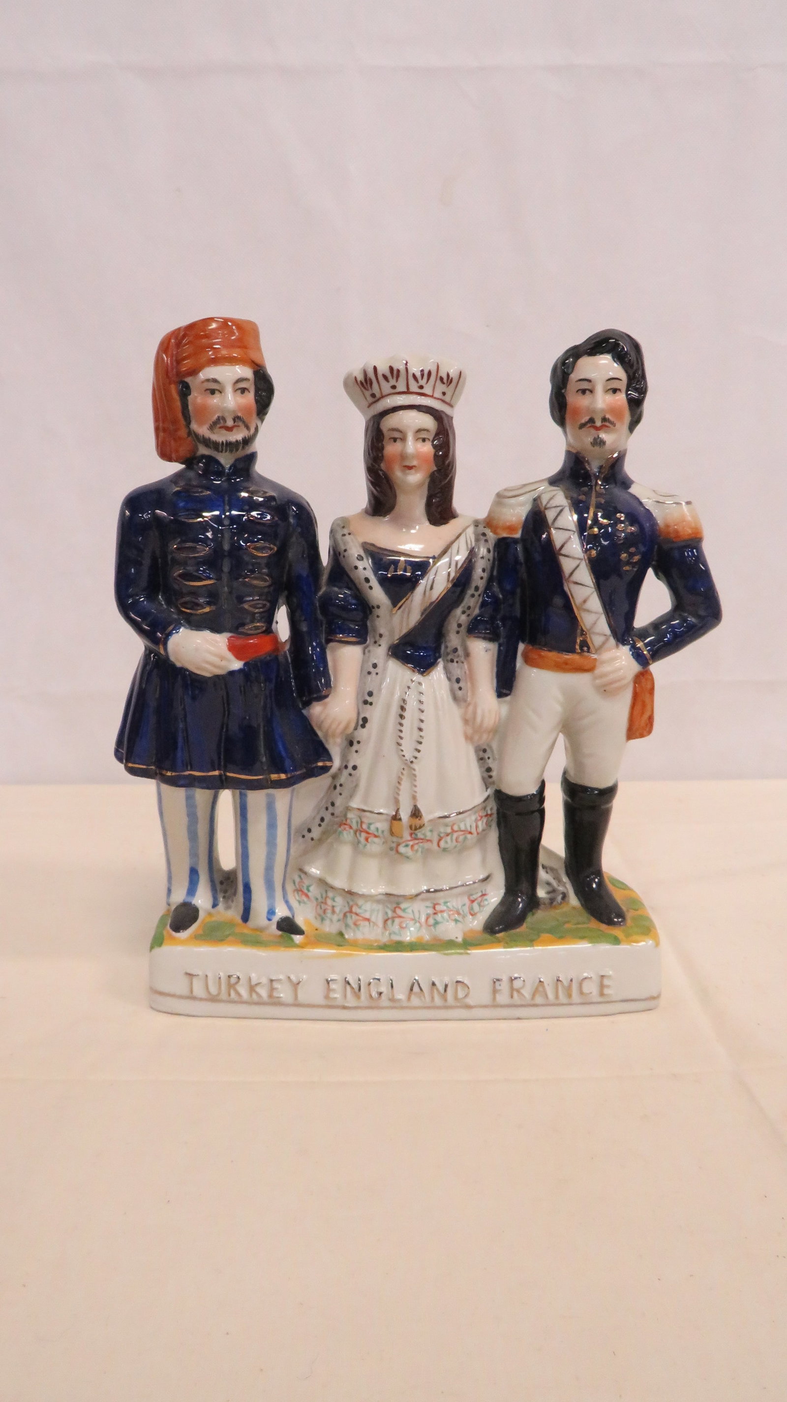 Victorian Staffordshire Mantel Figure Group: Mid 19th Century English Staffordshire figure commemorating the Crimean War alliance between Turkey, England, and France. Hand-painted polychrome enamels over a pearlware body. Hollow formed withorigi