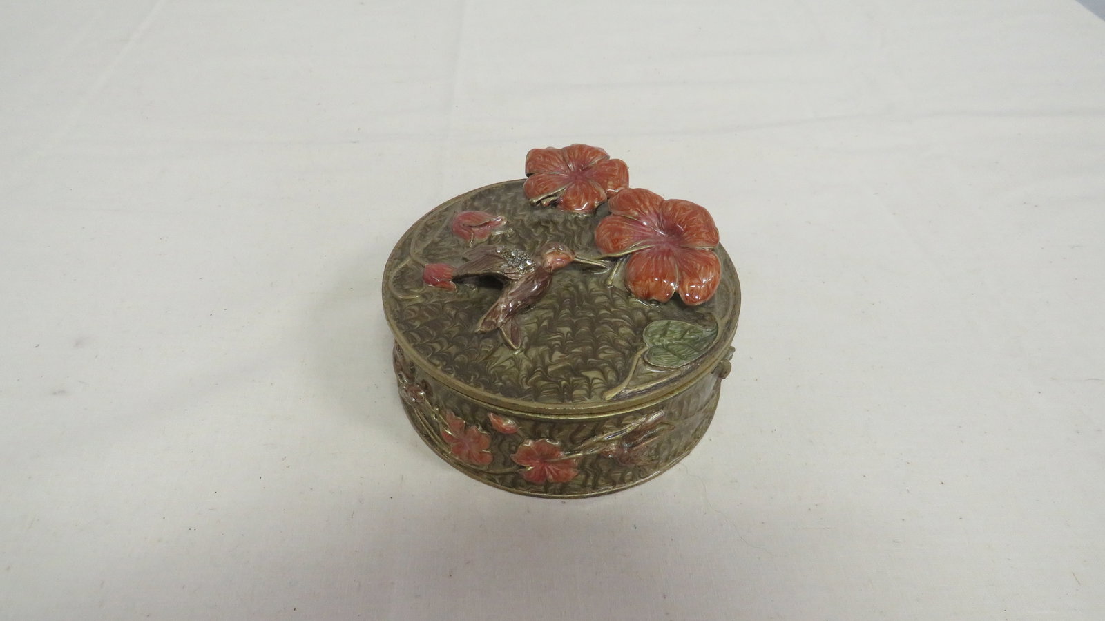 Enameled Metal Hummingbird Trinket Box: Enameled Metal Hummingbird Trinket Box in good condition. Mirror on underside of top. 2.5"H x 4.5"D