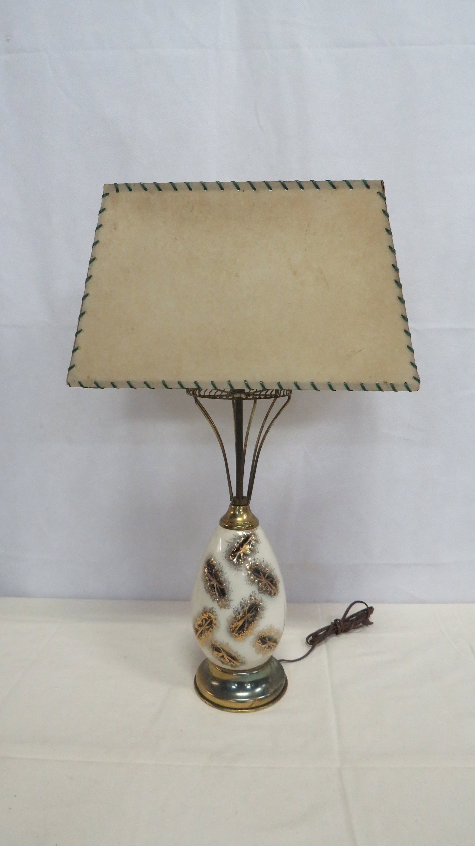 Mid Century Lamp: Mid Century Lamp in good condition. Some discoloration on shade. Over all height 26"