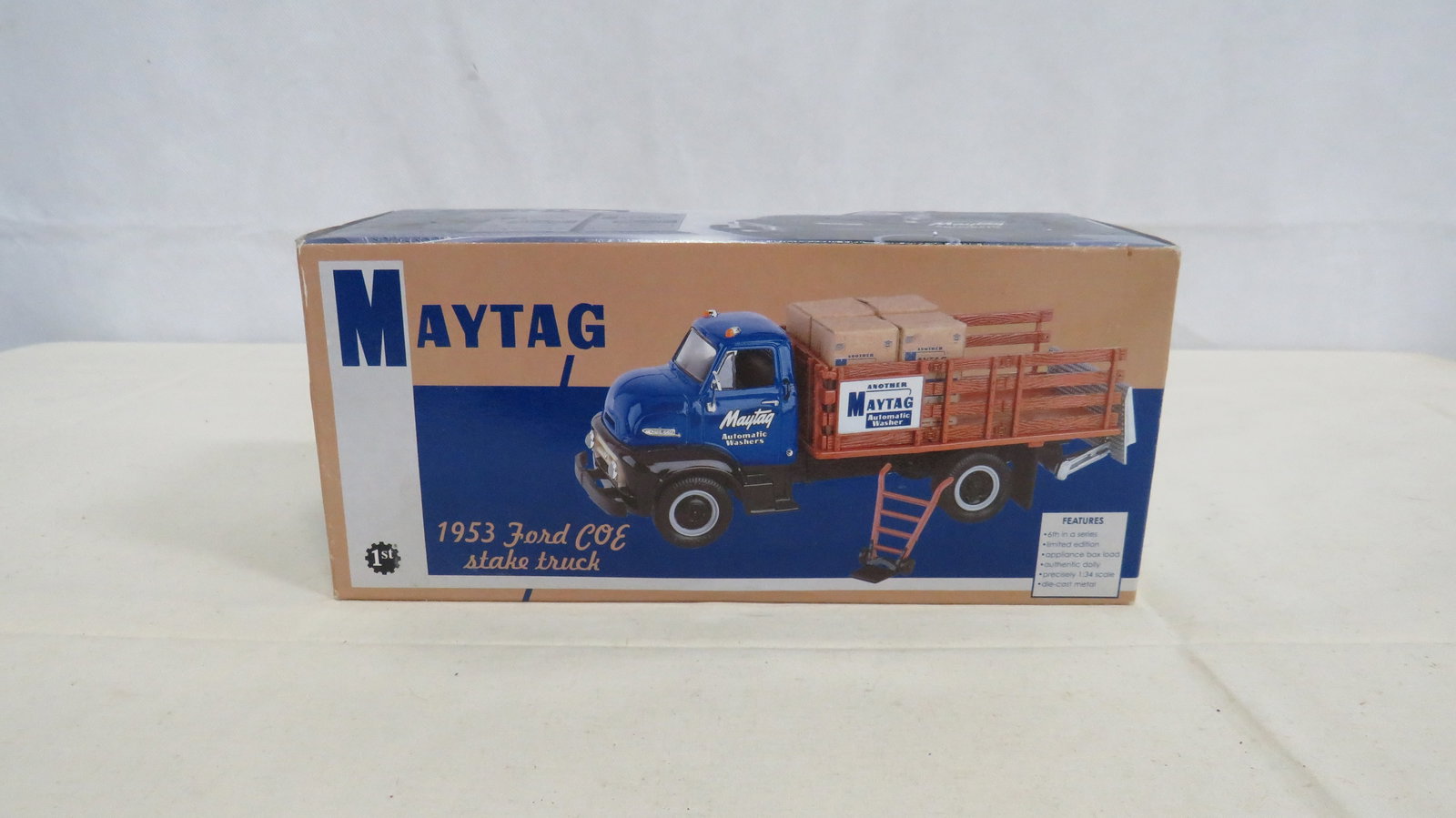 Die-Cast 1953 Ford Stake Truck Advertising Maytag: Die-Cast 1953 Ford Stake Truck Advertising Maytag. 1:34 scale distributed by First Gear. Limited Edition 1998. Includes appliance box load and dolly. Never removed from box. Box measures 4.25"H x