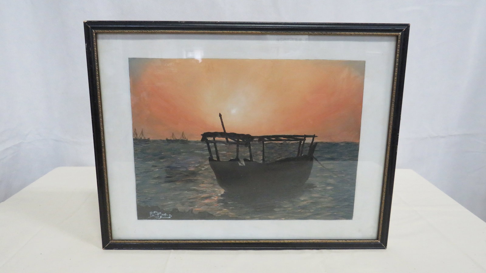 Signed Middle Eastern Oil Painting Karbala: Handpainted Oil on board depicting a silhouetted fishing boat at sunset, with distant sails on the horizon. Executed in expressive palette-knife and brushwok with heavy impasto texture to the