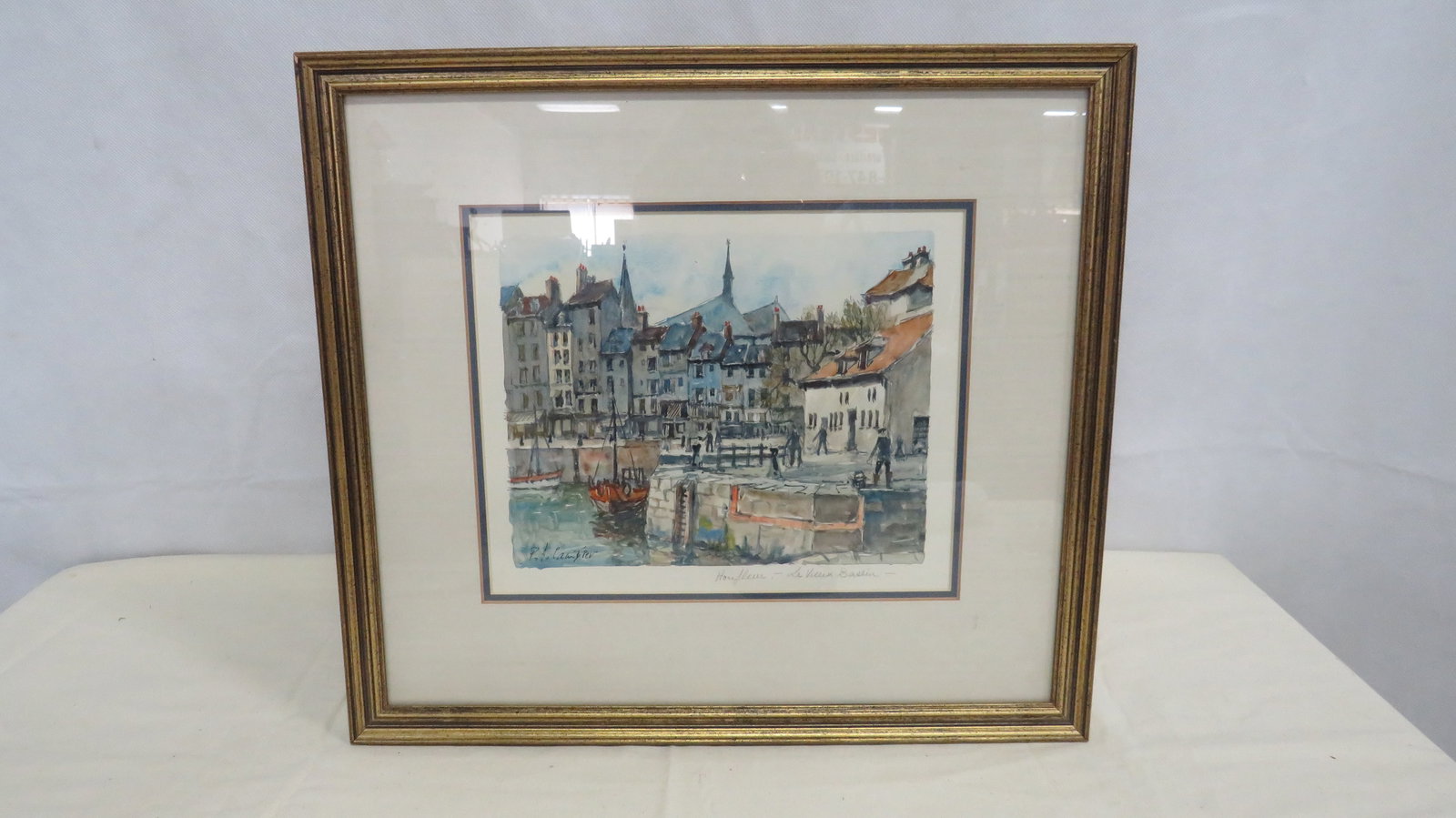 Honfleur Harbor Watercolor - Le Vieux Bassin: Original watercolor painting depicting Le Vieux Bassin harbor in Honfleur, France, with colorful waterfront buildings, fishing boats with tall masts, and figures along the quay. The composition 