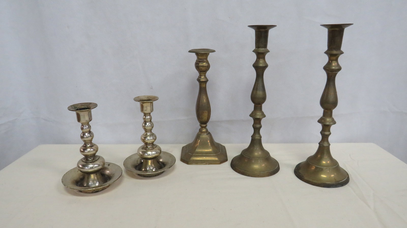 5 Vintage Brass Candle Sticks: 5 Vintage Brass Candle Sticks in good condition with age appropriate wear and tarnish. 6"H - 11"H
