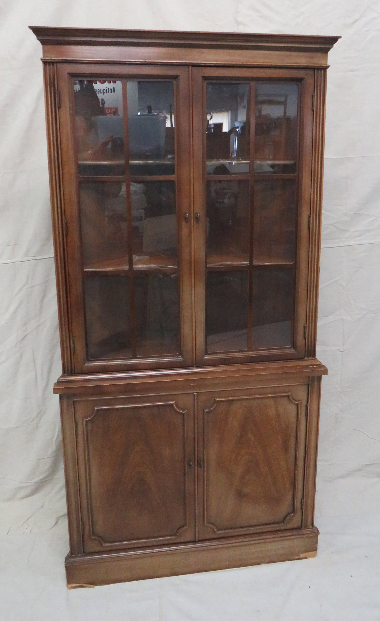 Vintage Mahogany Corner Cabinet: Vintage Mahogany Corner Cabinet in good condition, some veneer damage around base, Interior features shelving, 70.5''H x 35''W x 19.5''D