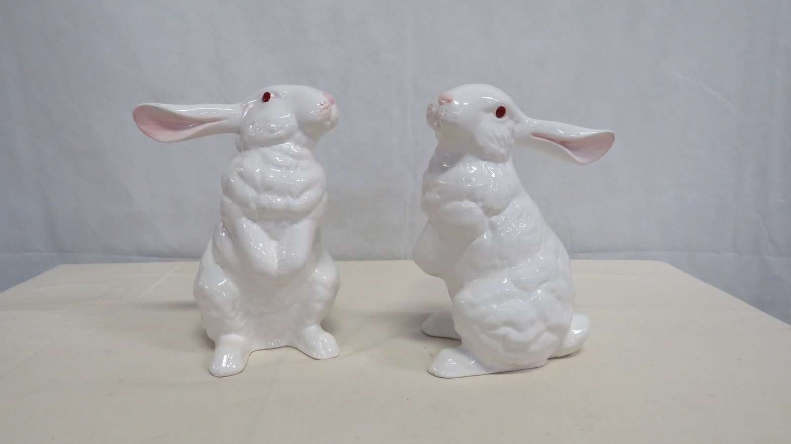 Pair of White & Pink Ceramic Bunny Rabbits: Pair of White & Pink Ceramic Bunny Rabbits in good condition with small chip on one ear. 9.5"H x 7"W