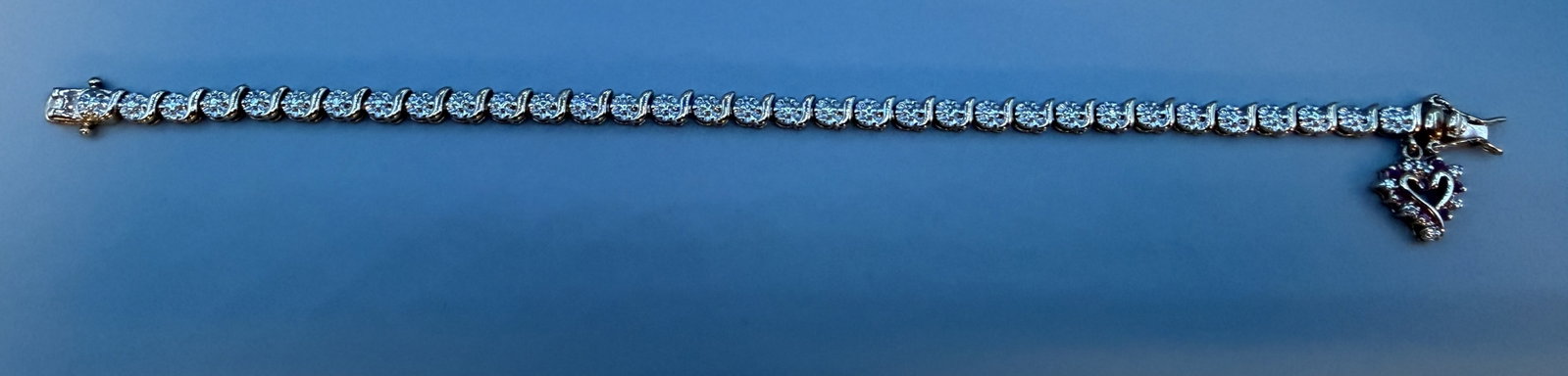 Sterling 7.5" Tennis Bracelet with Heart Charm: Sterling 7.5" Tennis Bracelet with Heart Charm in good condition, 10.93g