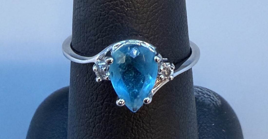 Sterling Pear Shape Blue Topaz & CZ Ring: Sterling Pear Shape Blue Topaz & CZ Ring in good condition. Marked 925 Size 7.75. 2.6g