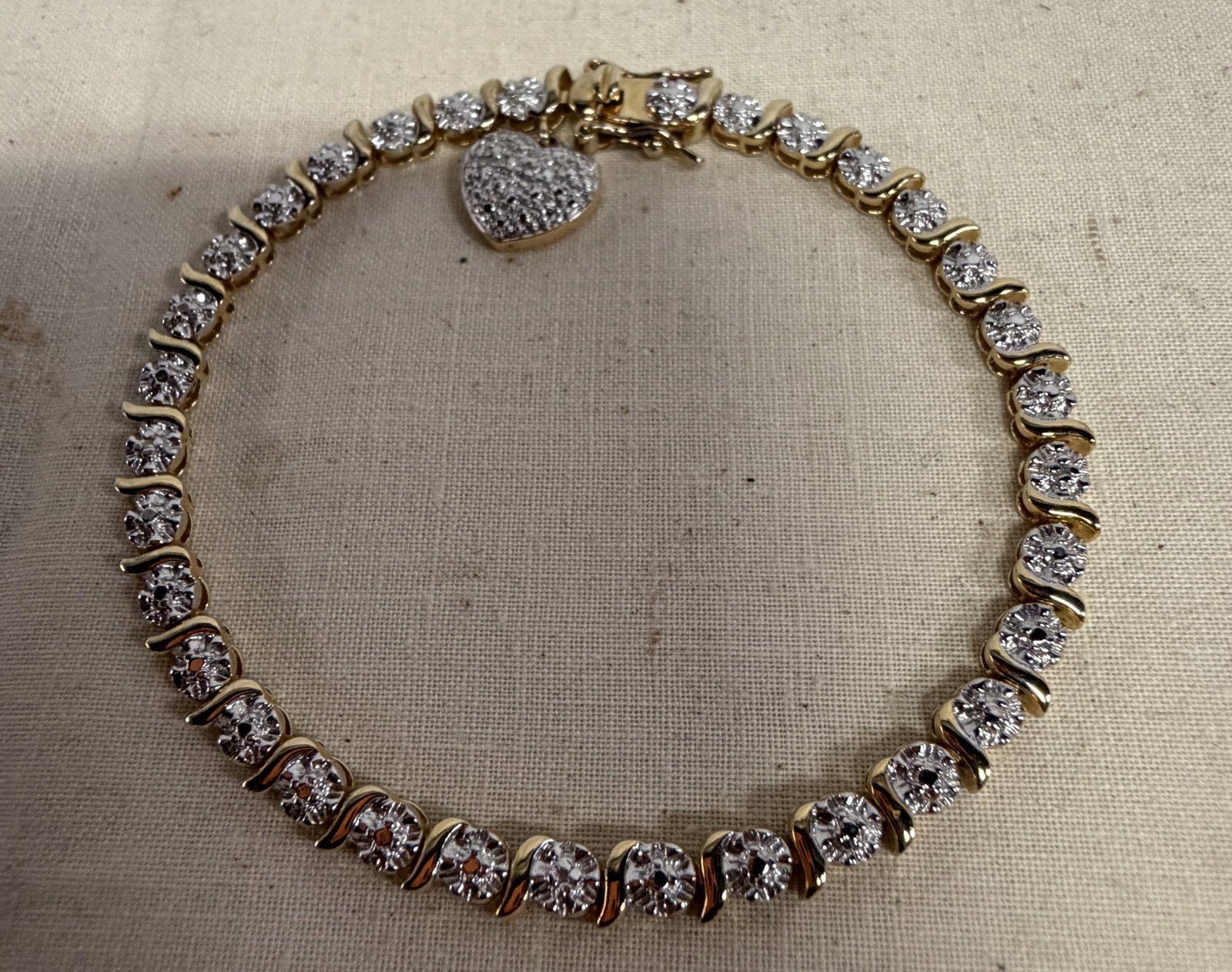 Gold over Sterling Tennis Bracelet w/ Heart Charm: Gold over Sterling 7.5" Tennis Bracelet w/ Heart Charm in good condition, 11.46g