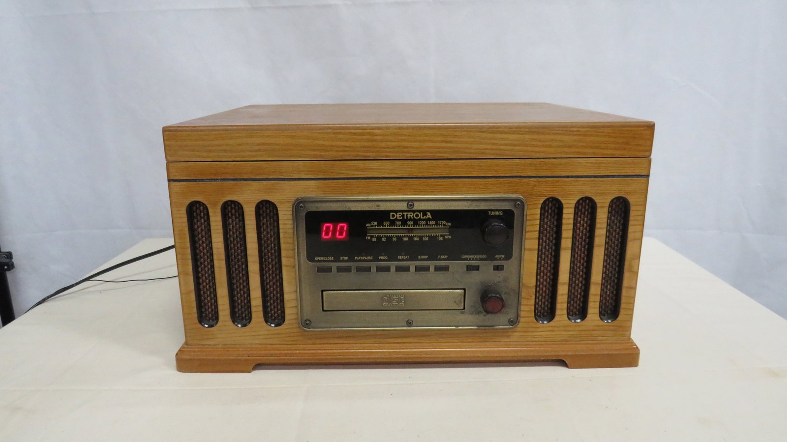 Vintage Detrola Replica Record Player: Vintage Detrola Replica Record Player. Record player and stereo work, CD player does not work. Cassette player untested. 9.25"H x 18"L x 13.5"W