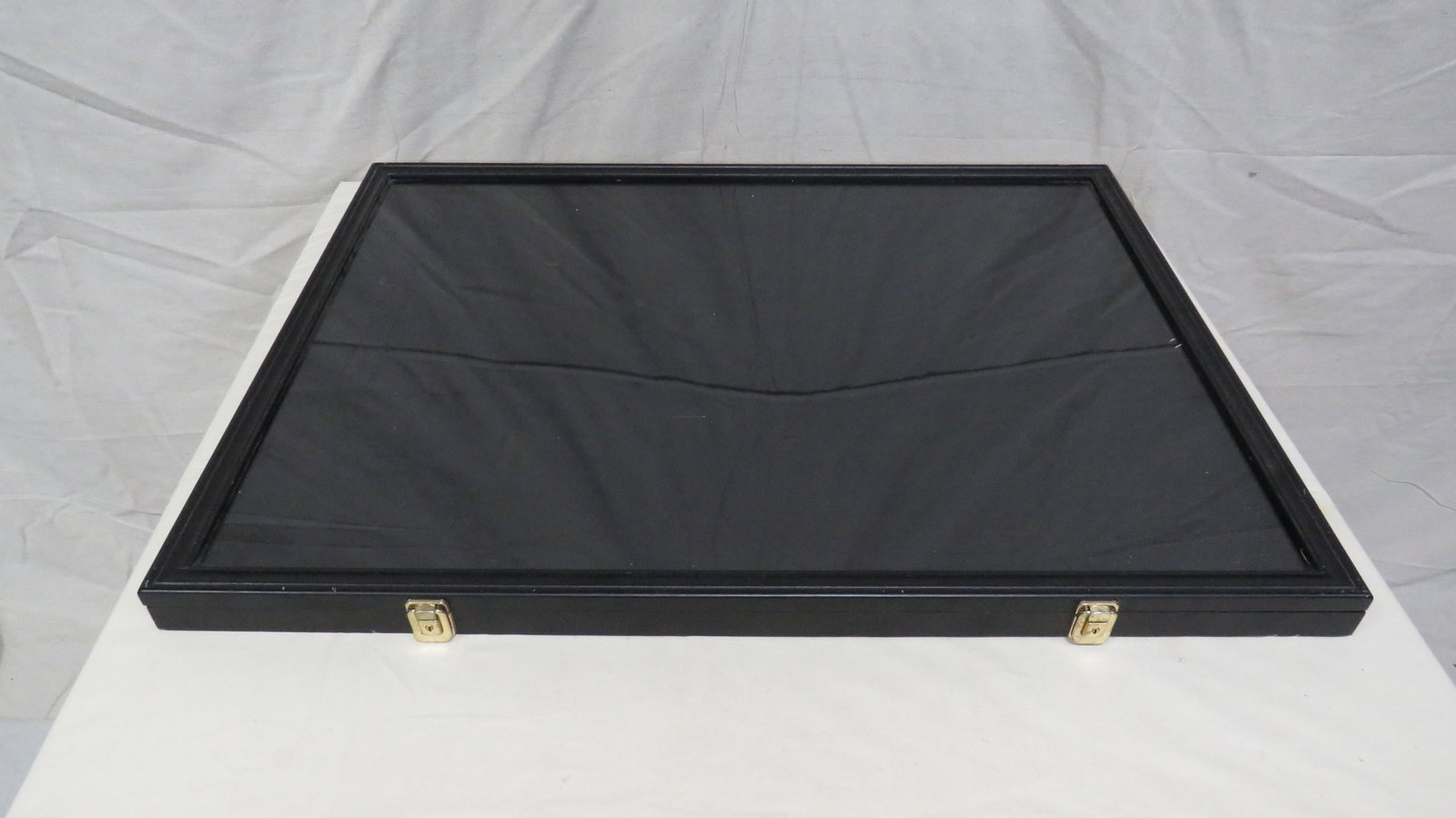 Large Tabletop Display Case: Large Tabletop Display Case 1.5"H x 31.5""L x 23.5""W in good condition.