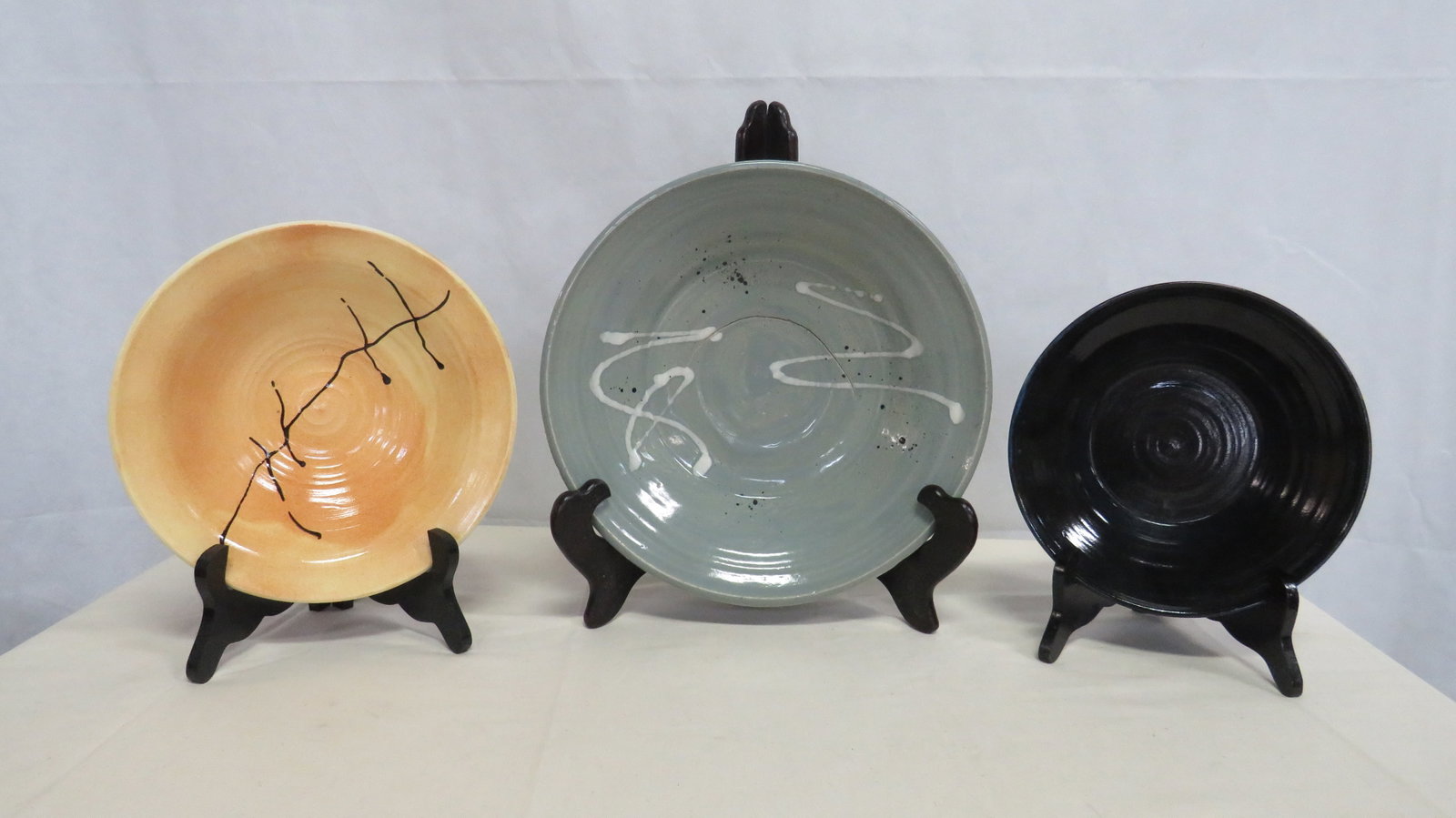 3 Vintage Studio Art Pottery Bowls: 3 Vintage Studio Art Pottery Bowls in good condition. The largest one has an irregularity in the center done during the making of the bowl. Each on is about 2.75"H with diameters from 8.5" to 12"