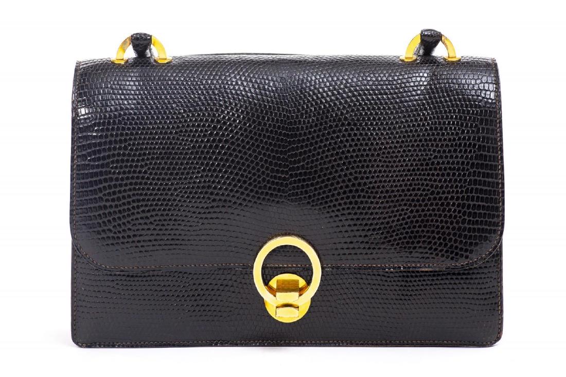 Sac pochette Hermès en varan du Nil: Sac pochette Hermès en varan du Nil modèle Ring années 70 anse solide H. 18x26.5x6 cm Vendu sans Citès Vintage – Mode – Accessoires Vintage Fashion and Accessories