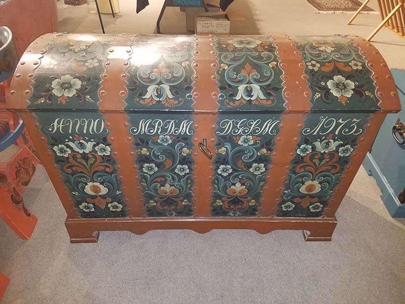 Nils Ellingsgard Rosemaling dome top chest: Nils Ellingsgard Rosemaling dome top chest dated 1973. The chest was imported from Norway by the Madden's in 1972 and custom painted with initials MRDM & DGLM. Five metal straps with iron handles and 