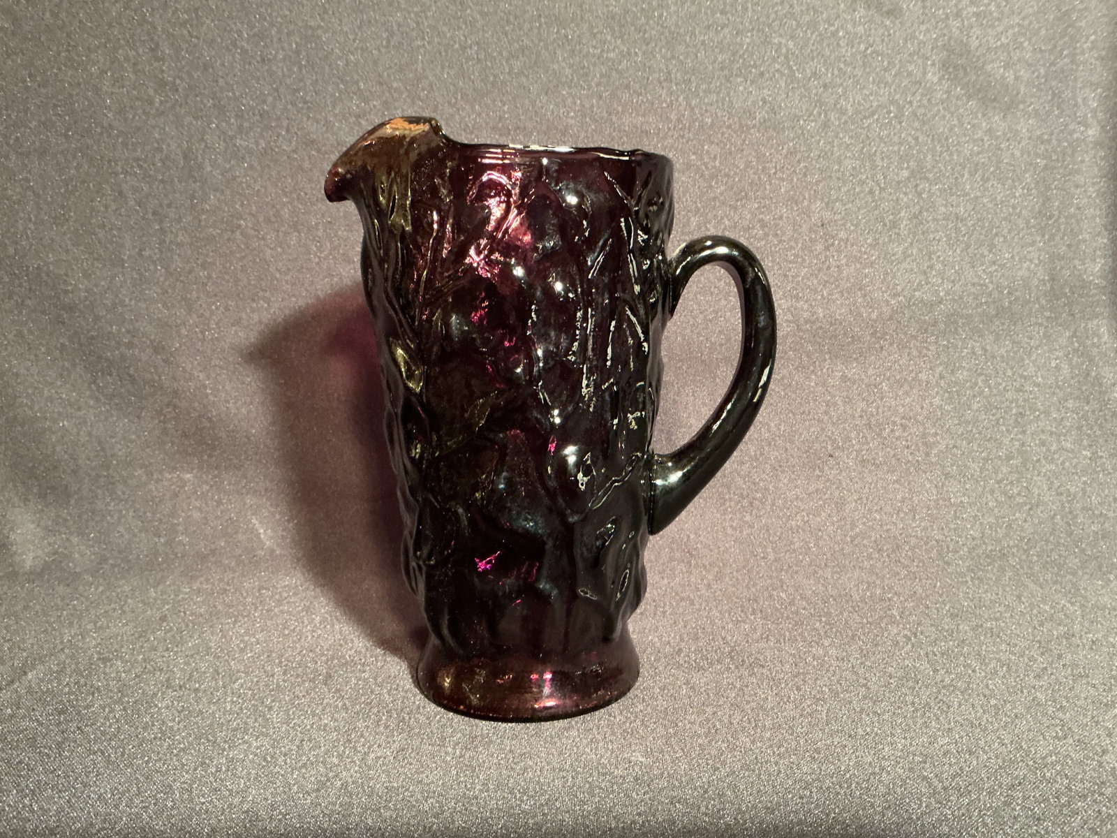 Amethyst Glass Water Pitcher: Unmarked. With deep sculpted overall pattern.