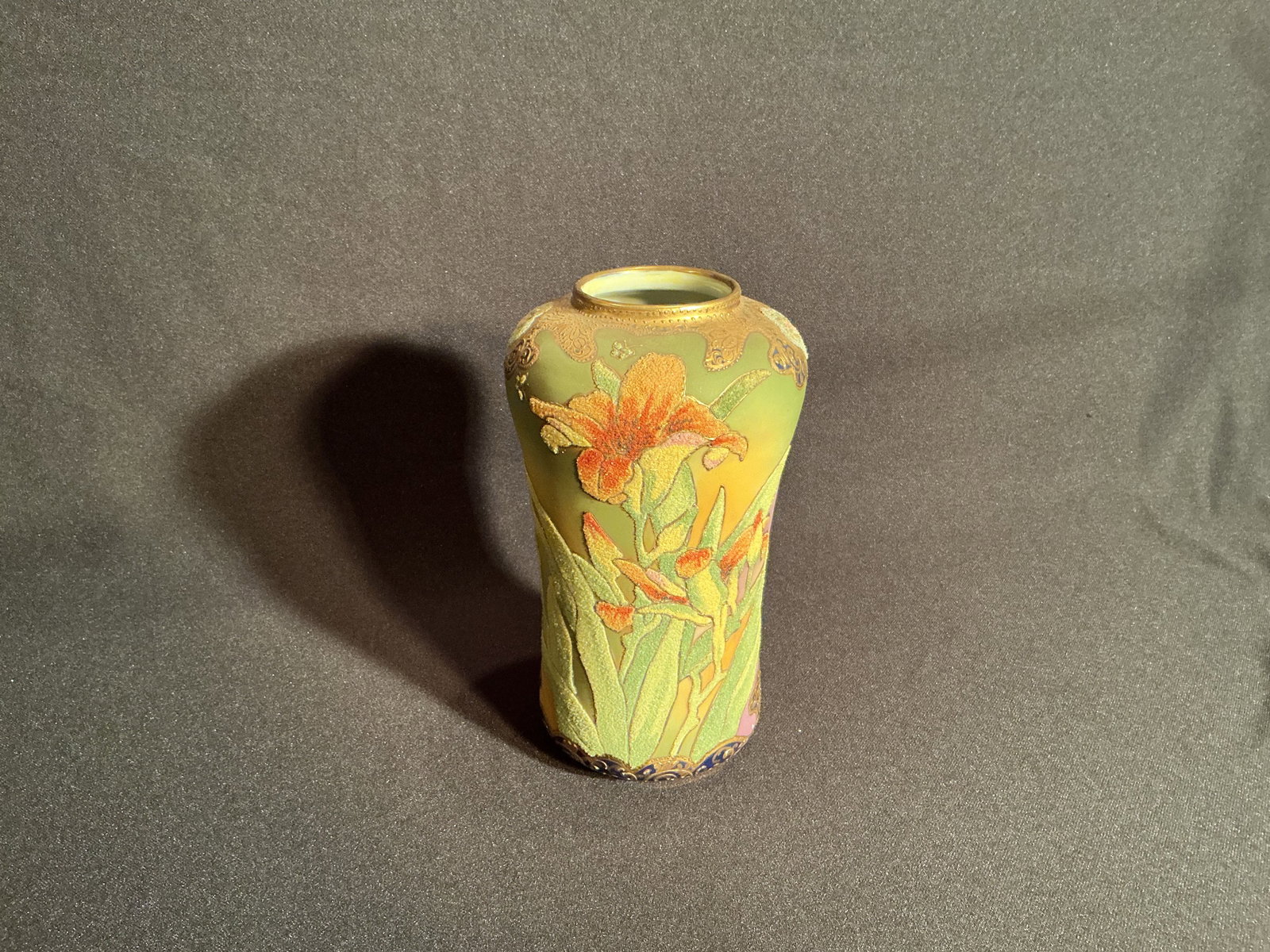 Nippon Coralene Vase: Nippon Coralene Vase with beautiful overall Lilly design on gradient green ground surface plus gold gilt design around bottom and top opening.